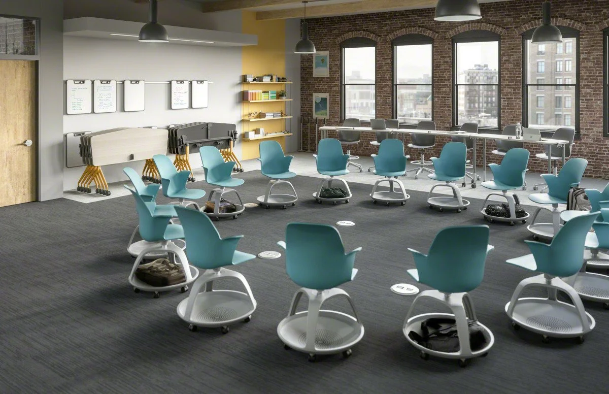 Classroom featuring Steelcase Learning Node chairs arranged in a circle, with wheels for mobility, modular design, and bases for storing backpacks and school supplies.