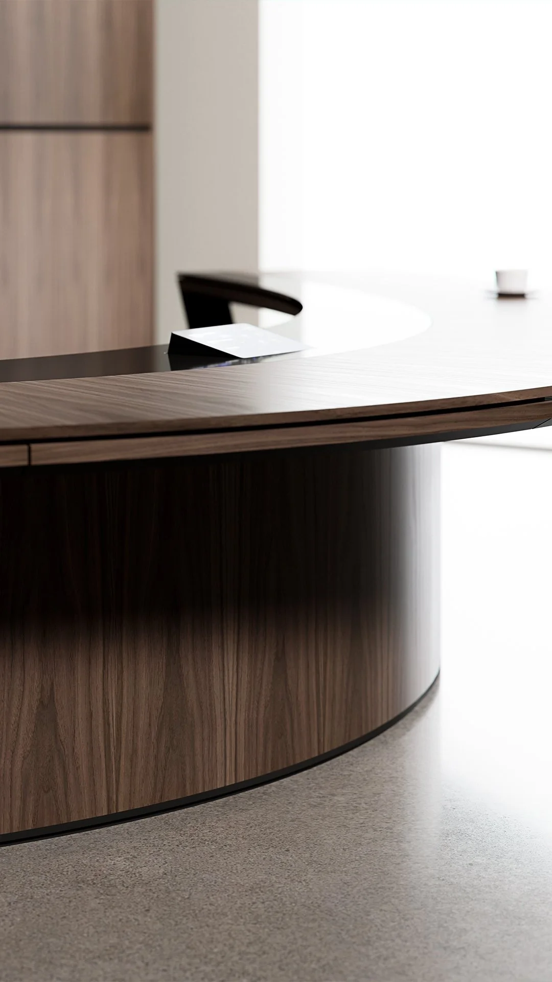 Close-up of a modern, curved wooden reception desk from Halcon in an office setting.