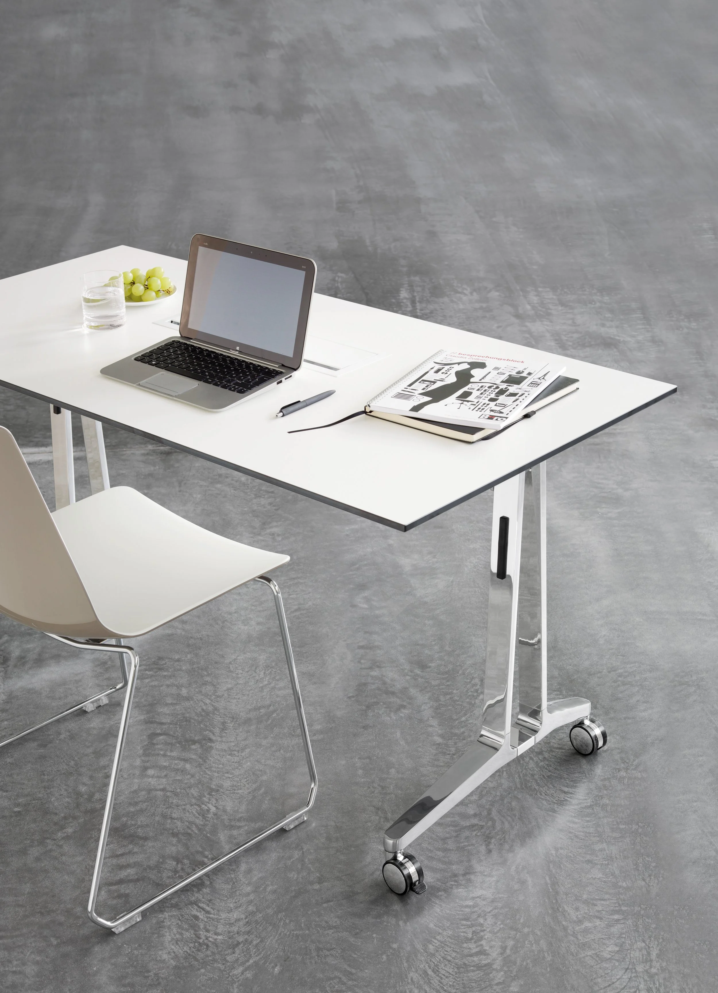 White desk from Halcon in a modern office or meeting room.