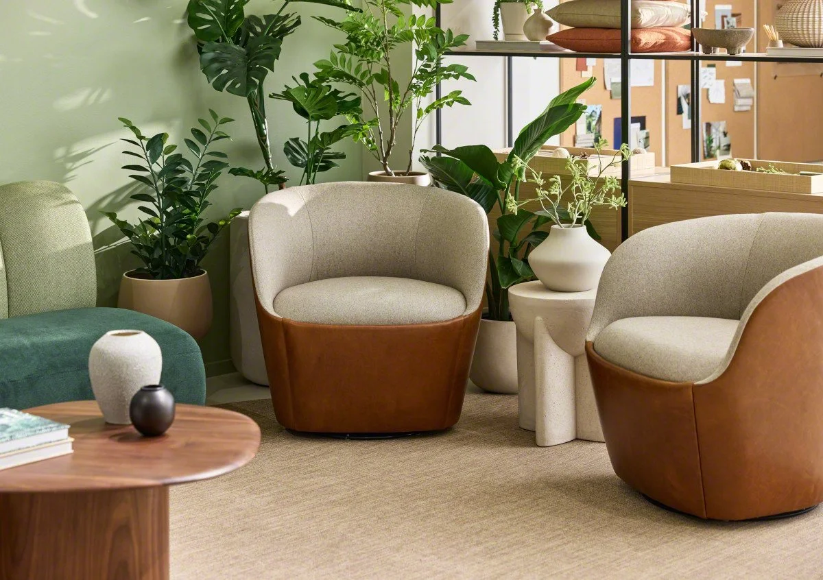 Cozy sitting area with modern beige and leather armchairs and side tables from West Elm Work.