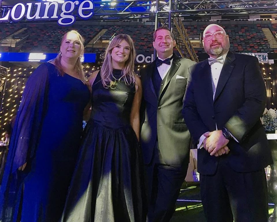 Katy Lovell, Sophia Bankson, Robert Artigues, and Paul Maczka posing for a photo at the Ochsner Moonlight & Miracles Gala, presented by the Gayle and Tom Benson Foundation.