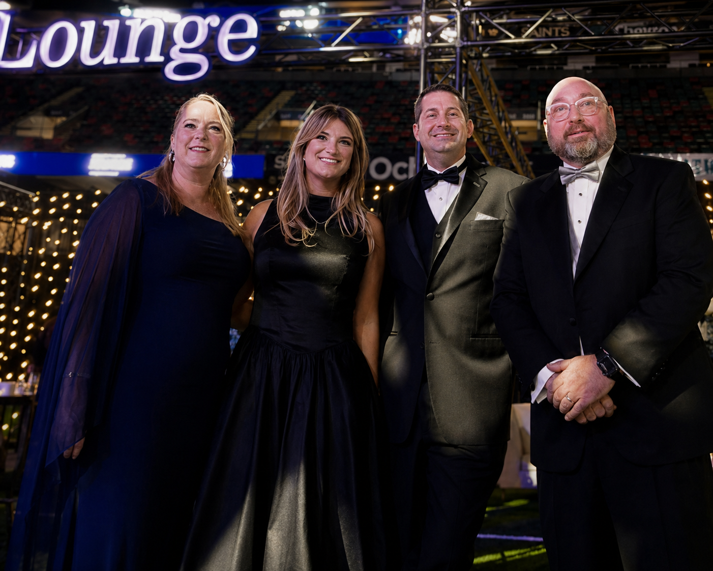 Katy Lovell, Sophia Bankson, Robert Artigues, and Paul Maczka posing for a photo at the Ochsner Moonlight & Miracles Gala, presented by the Gayle and Tom Benson Foundation.