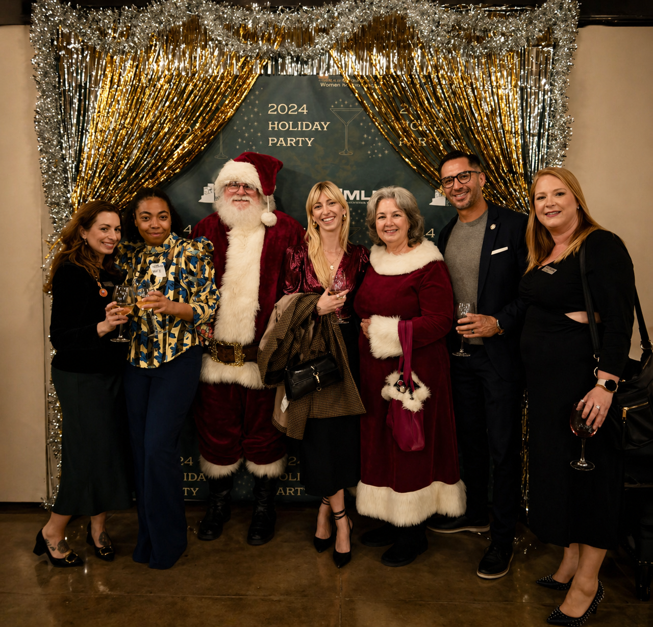 The Workplace Solutions team posing with Santa and Mrs. Claus at the 2024 Holiday Party for the built environment industry, hosted by AIA New Orleans, the International Interior Design Association, NAWIC, and the Urban Land Institute.