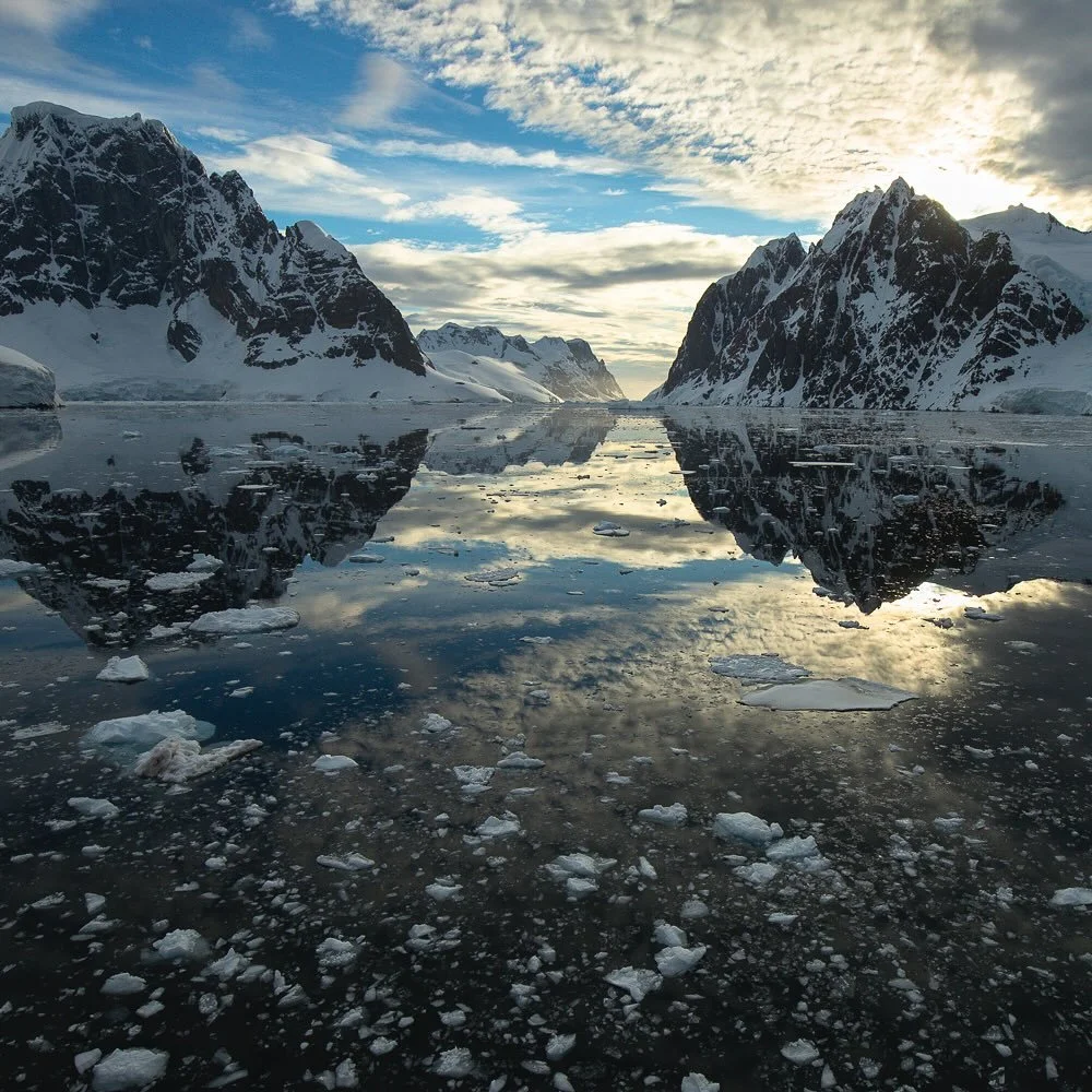 Fine Art Friday! &ldquo;Lemaire Channel Sunset&rdquo;. 

Ah, the majestic beauty of icy reflections in the Lemaire Channel, Antarctica! I promise this isn&rsquo;t just a clever Photoshop trick. This image was taken on the last day of the year 2018.  