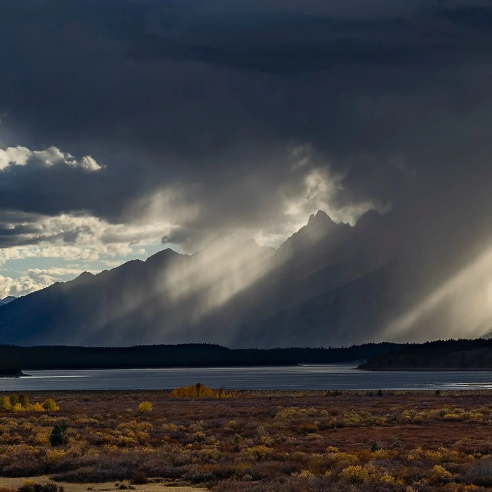 Photo by @TimLaman.  Last week in Grand Teton National Park, we had this crazy light show of backlit rain over the Teton crest one afternoon!  Photographed over Jackson Lake. #grandtetonnationalpark #grandteton #nationalparks