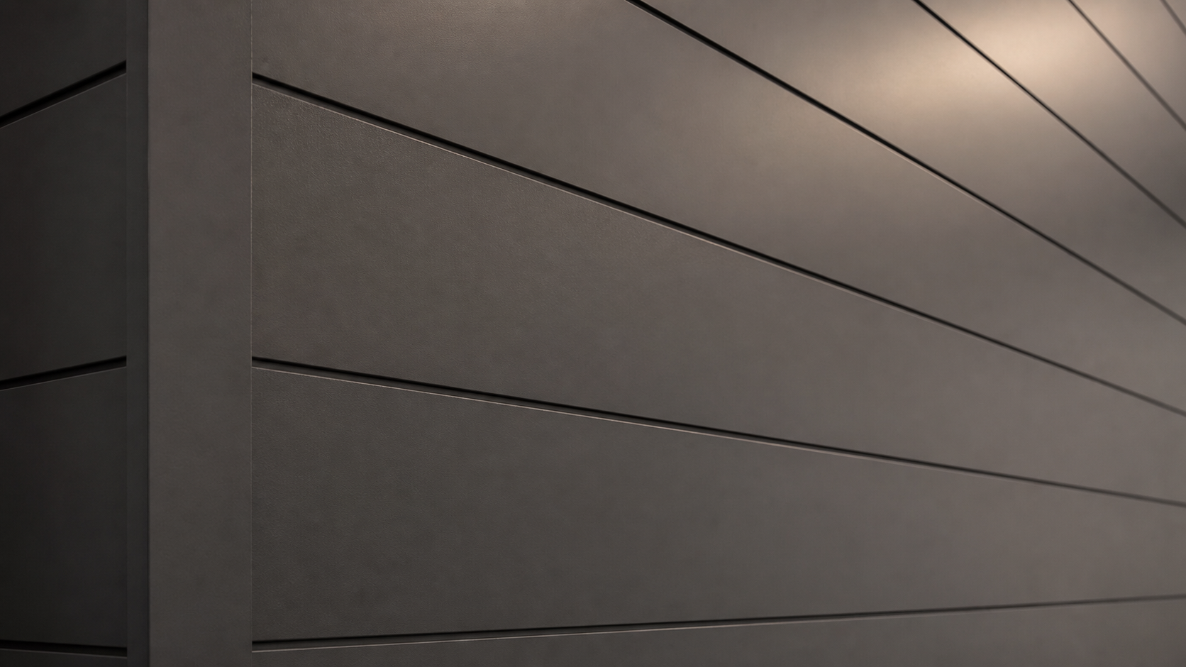 Close-up of dark graphite shiplap panels with a smooth professional spray-painted finish and precise seams.