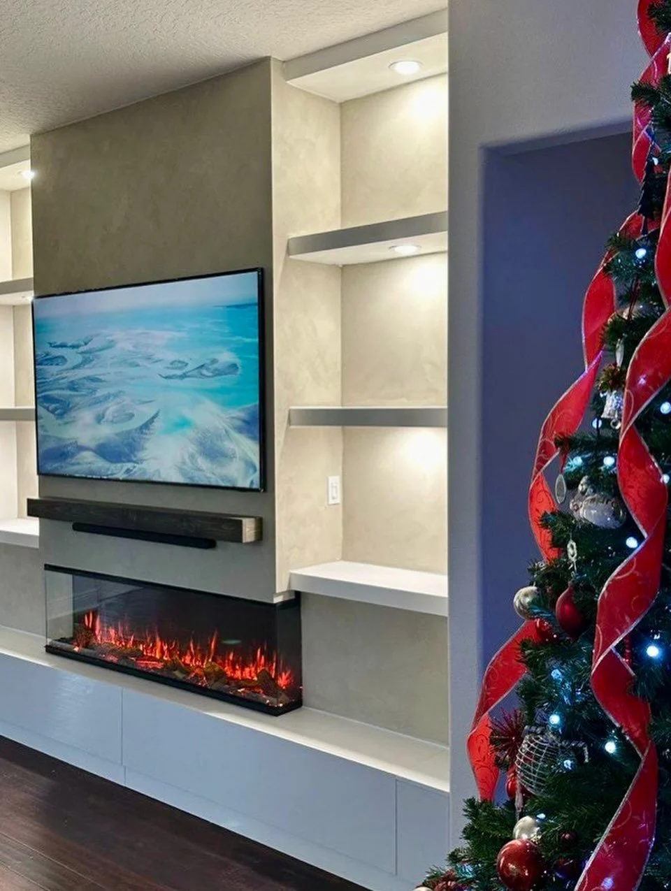 Palmer Ranch, Sarasota County, Florida - Limewash Media Wall with 3-Sided Electric Fireplace, LED Niches, and Hidden Storage - request a free estimate TVMEDIAWALL.COM #mediawall #sarasota # limewash