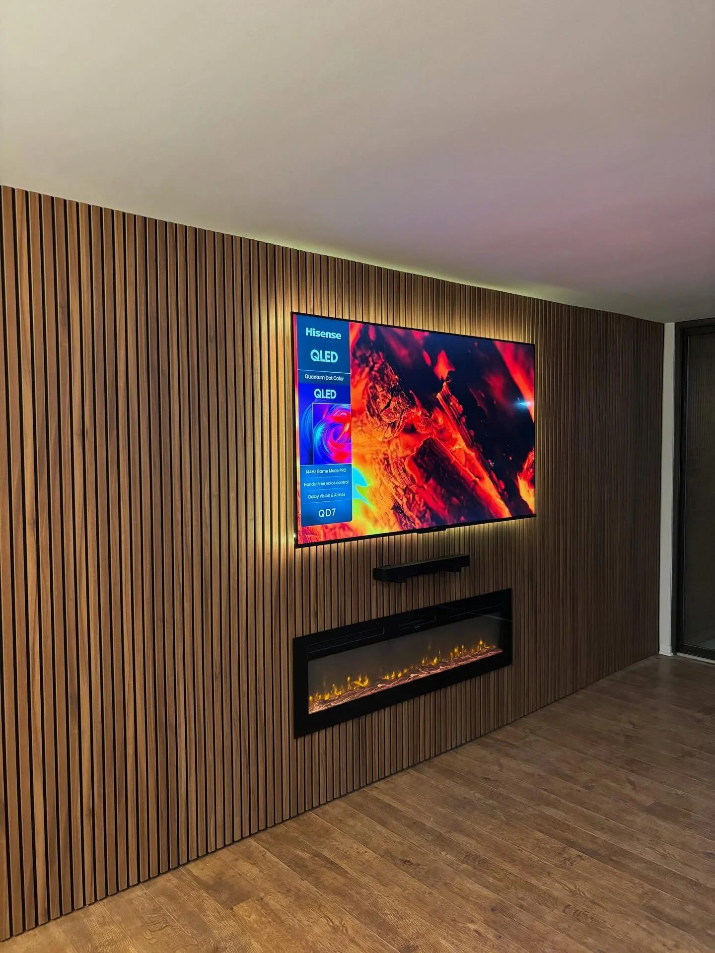 Clean wood slat media wall with fireplace. Orlando, Florida. Full wall solution with LED backlighting, hidden wiring, and precise alignment. The entire wall works as one system, not just a TV area.

We design and build custom media walls across Flori
