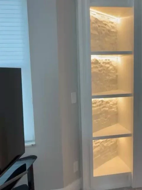 White Stone Fireplace Media Wall with Illuminated Display Niches &ndash; Clearwater Beach, Florida | tvmediawall.com