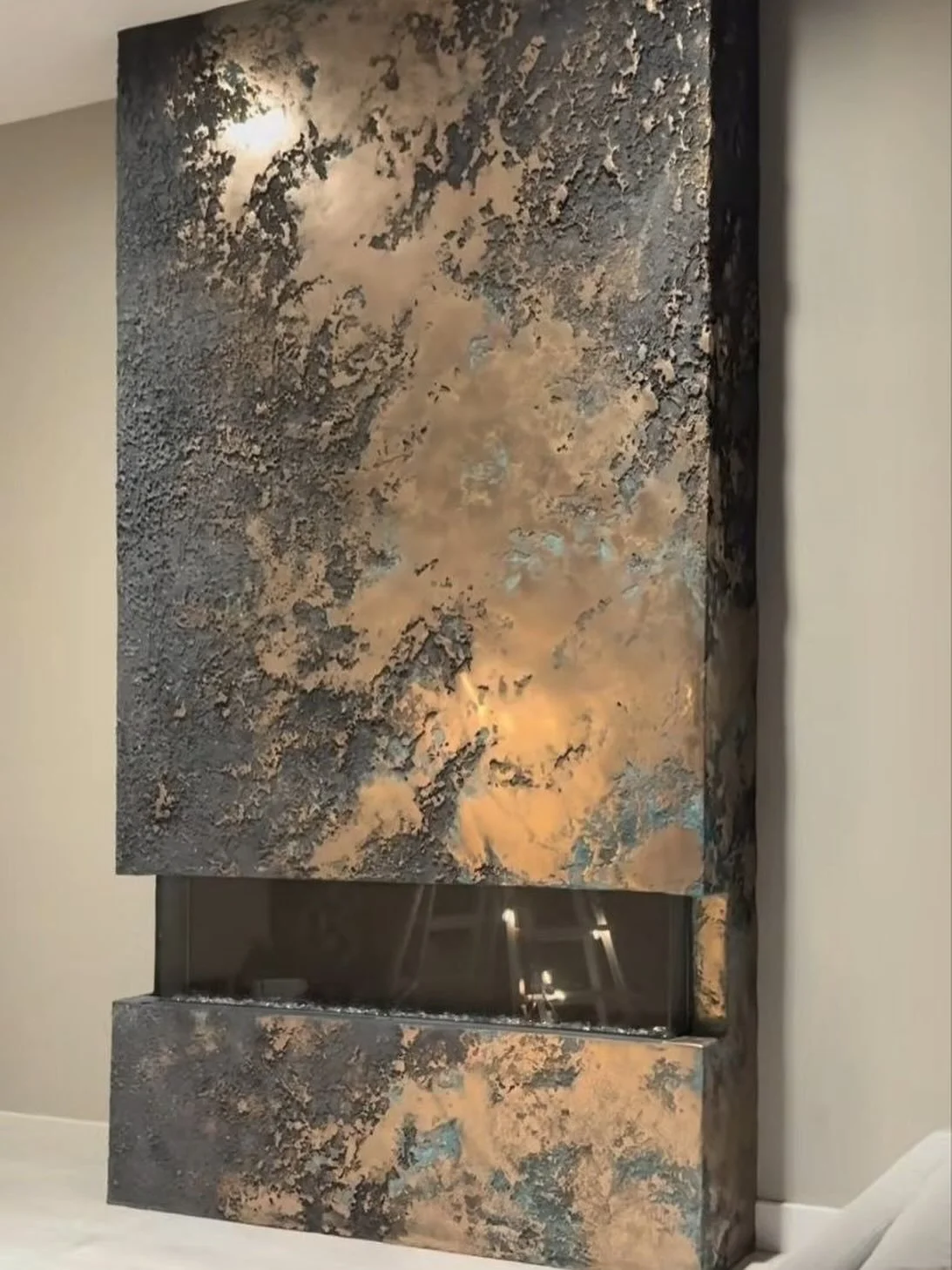 In progress.

A bold custom fireplace wall with a raw metallic texture, deep relief finish, and dramatic modern character. This project combines art, architecture, and fireplace design into one statement feature wall.

Every layer is being built by h