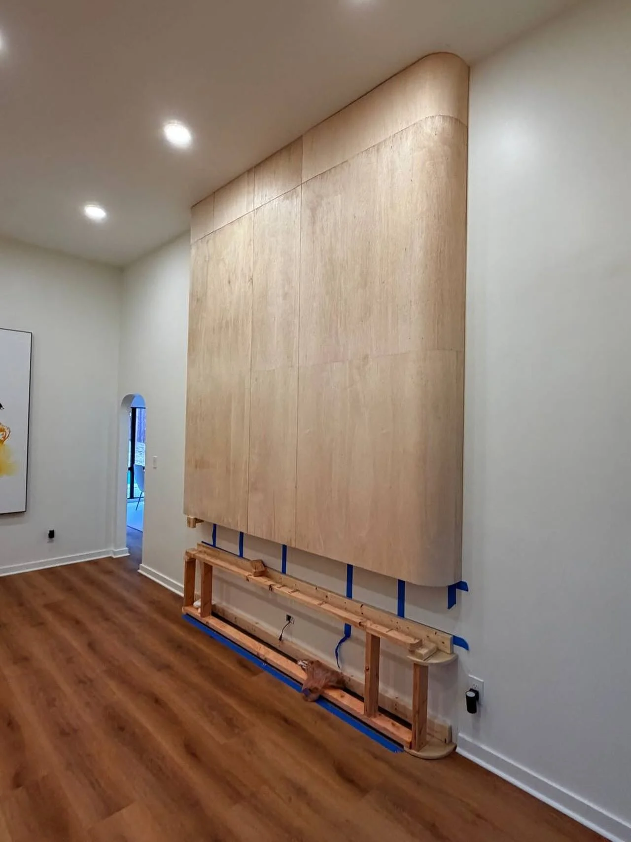 Work in progress.

A clean modern media wall taking shape with soft curved corners, full-height wood paneling, and a floating architectural design. This project focuses on smooth proportions, minimalist detailing, and premium finish carpentry.

The l