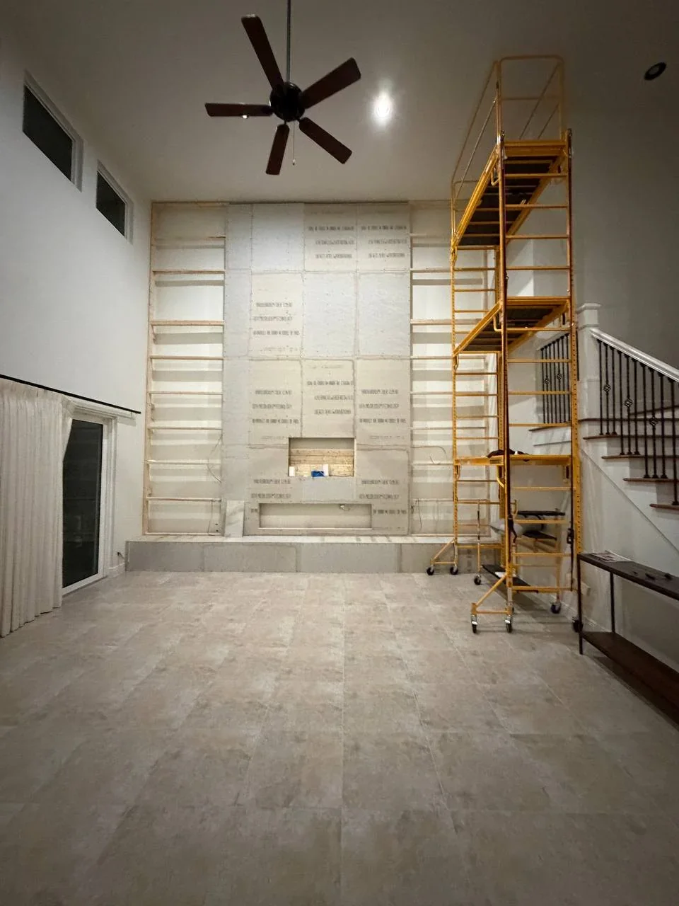 vero-beach-high-ceiling-media-wall-construction.webp