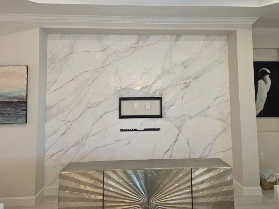 A-Series media wall installation in Sarasota Florida featuring custom Venetian plaster finish and integrated TV mounting area.