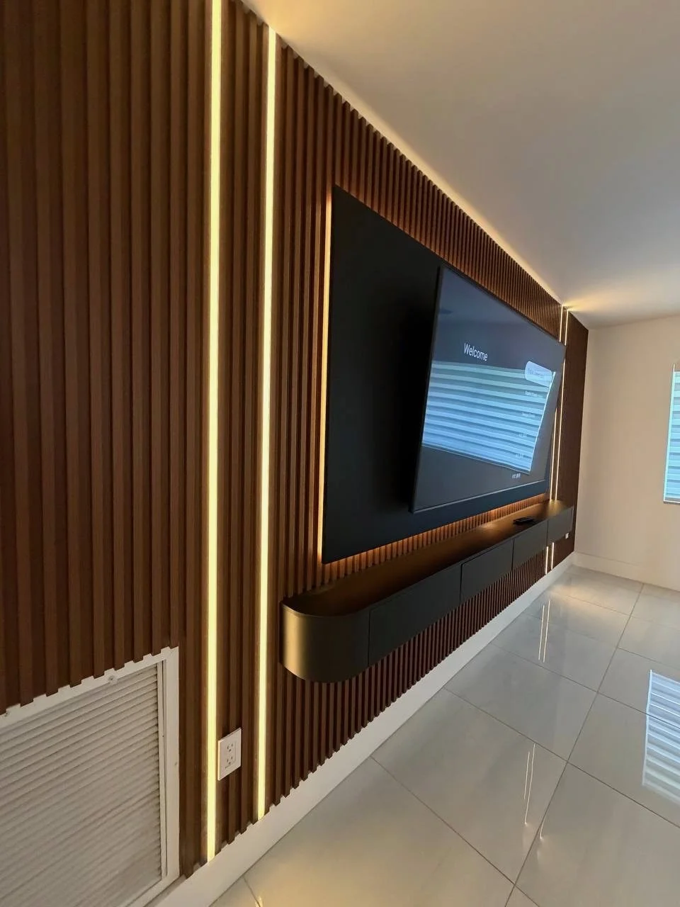Modern Slat TV Wall with Integrated Lighting in the Miami Area