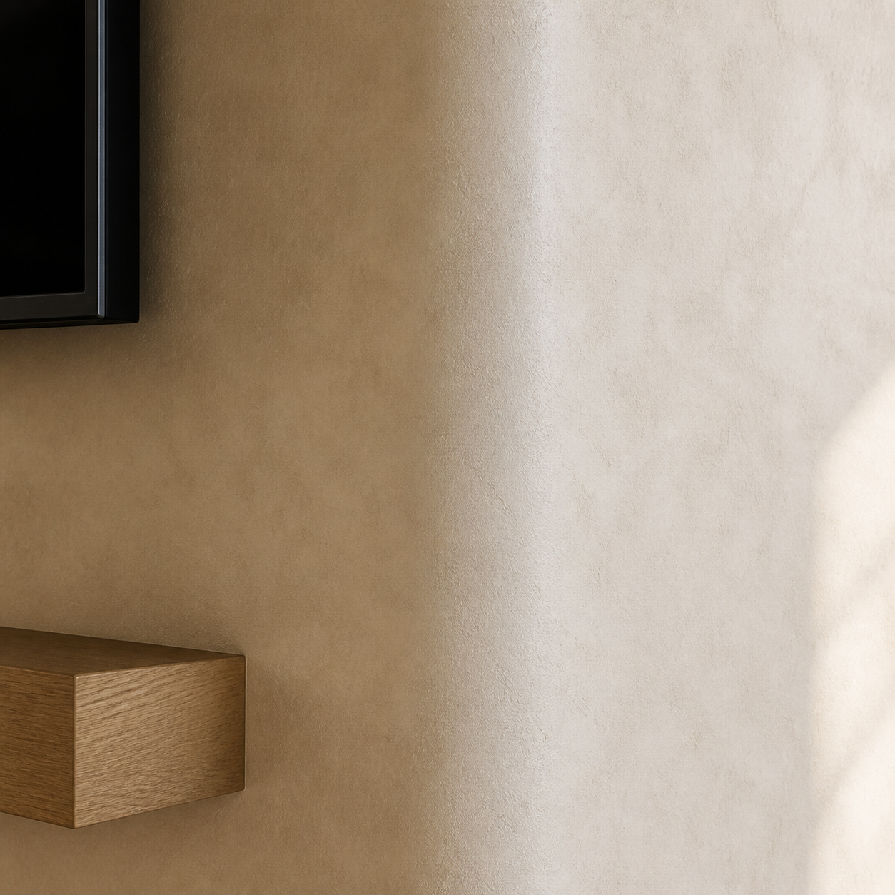Close detail of warm sandy and limestone-toned limewash surfaces with subtle mineral texture and tonal variation