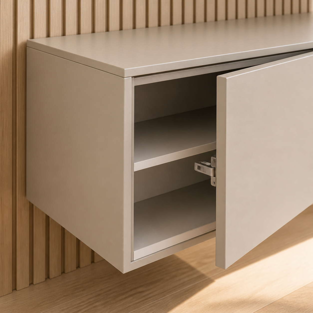 Close-up of a floating media cabinet with painted exterior, finished interior, and concealed hardware
