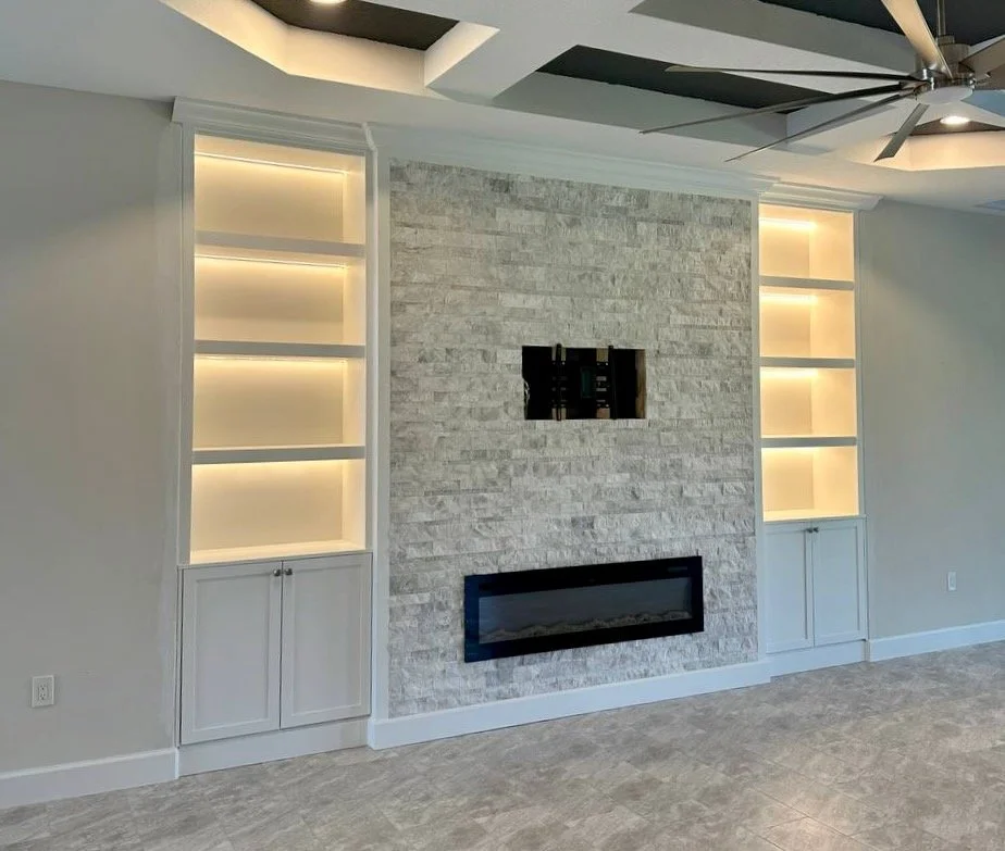 Luxury built-in media wall with custom shelving in Florida