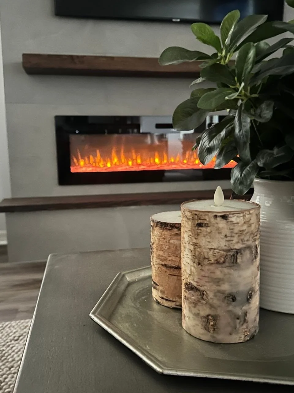 side view of floating mantel and electric fireplace alignment