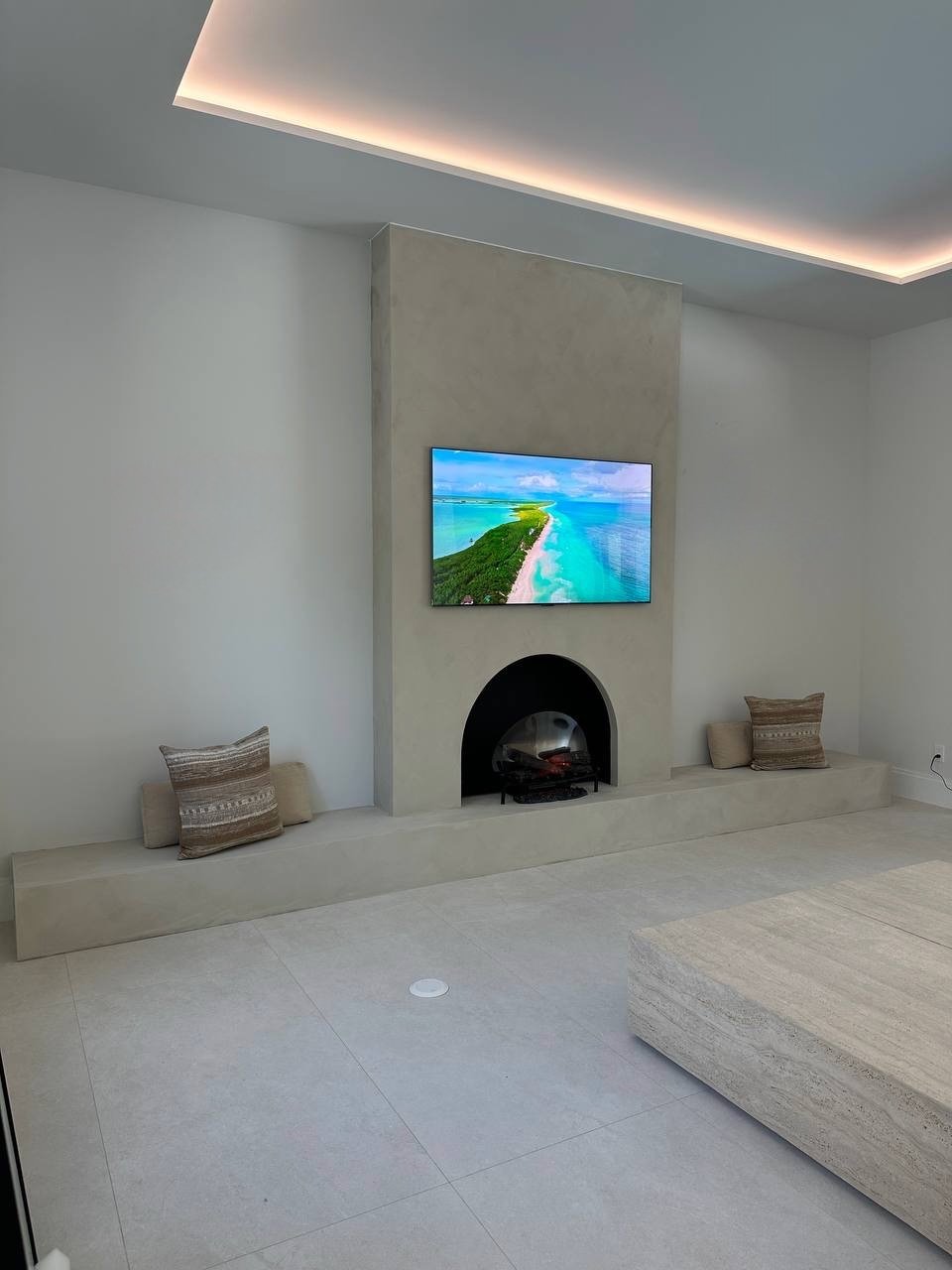 Mediterranean Hearth Wall with Arched Fireplace in Boca Raton, Florida