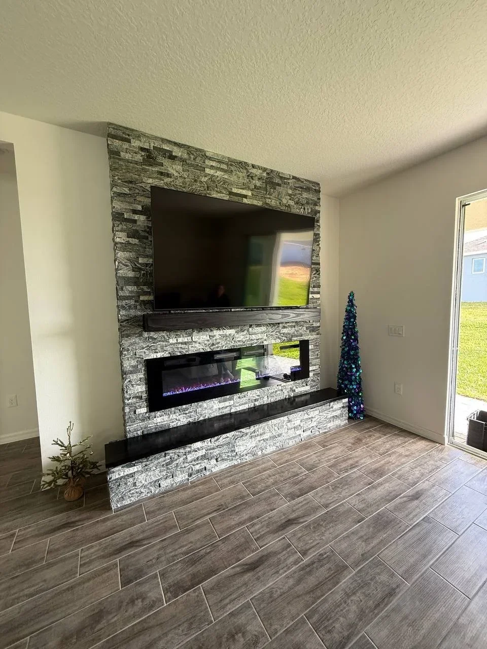 Ledger Stone Fireplace Buildout Media Wall with Wood Bench_02.webp