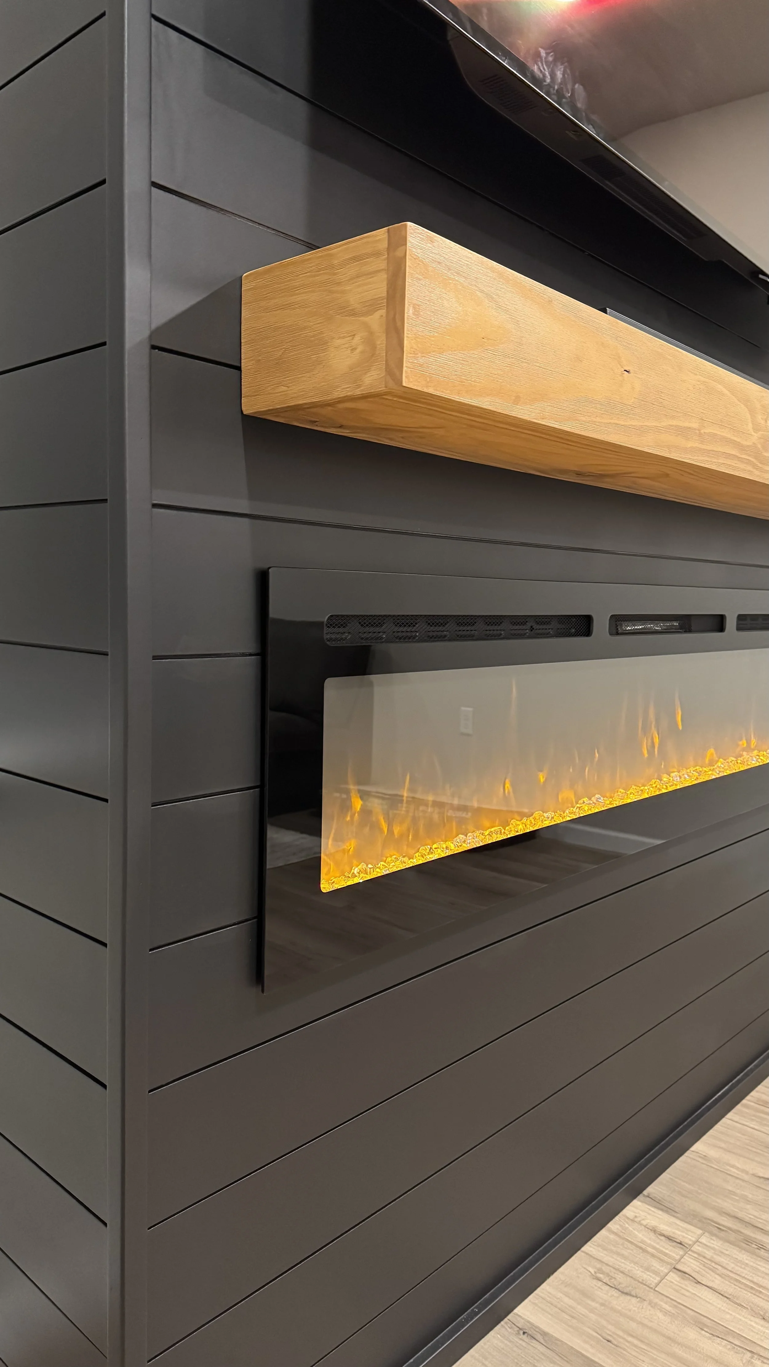 Sarasota_Side View of Wood Mantel and Electric Fireplace.jpeg