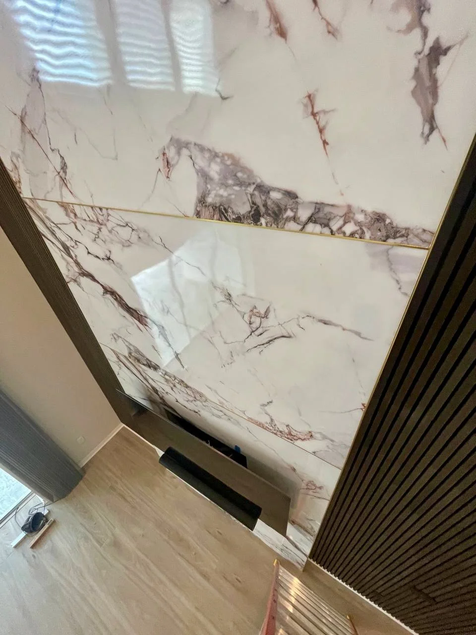 Close-up of marble slab panels on modern media wall