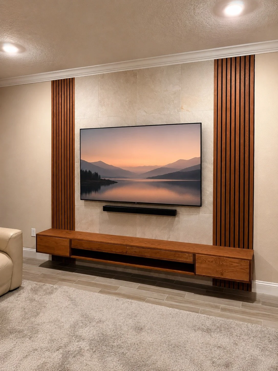 Modern floating entertainment built-in with wood media cabinet, porcelain tile wall and custom wood slat panels in Jacksonville Florida