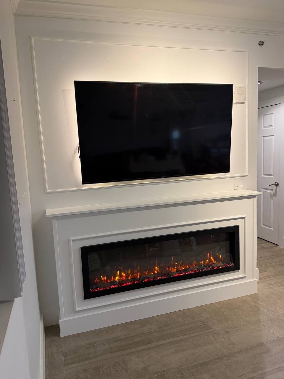 Fireplace Media Accent Wall with Decorative Trim in Miami, Florida