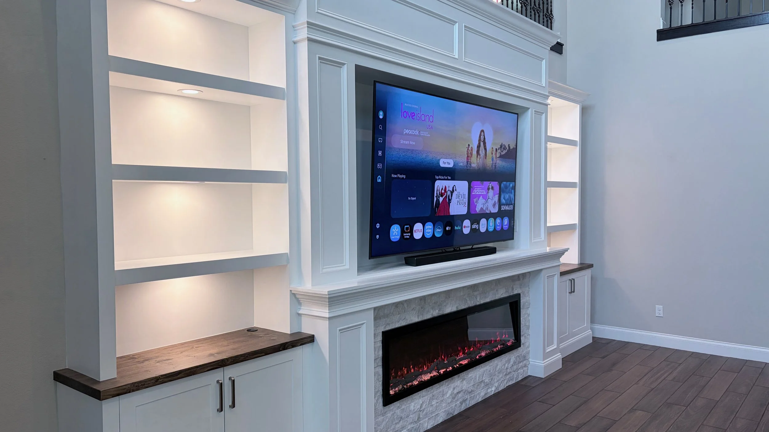 Custom cabinet and shelf system with integrated LED lighting and premium finish carpentry details