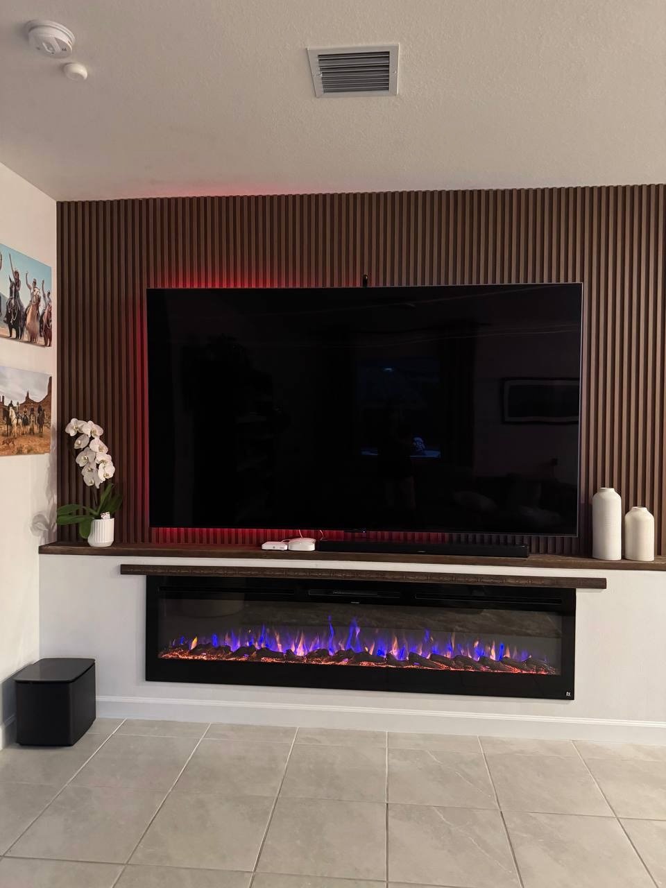 slat fireplace media wall miami modern tv wall with electric fireplace and wood mantle