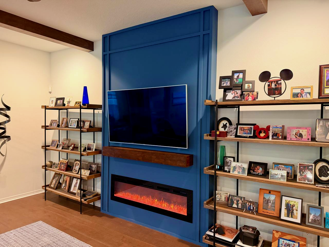 Decorative trim fireplace wall detail with custom paint and electric fireplace in Altamonte Springs