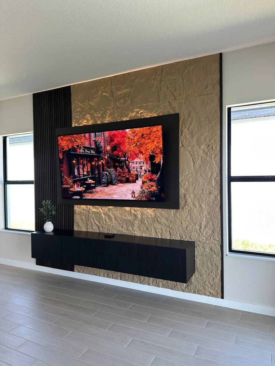 Modern Floating TV Panel Media Wall with Textured Stone Finish in Orlando, Florida