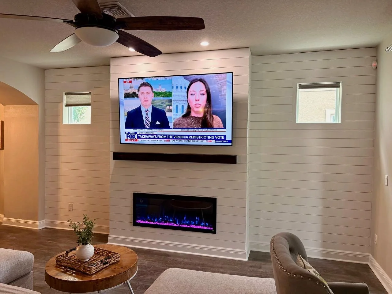 Wide view of shiplap media wall across entire living room wall