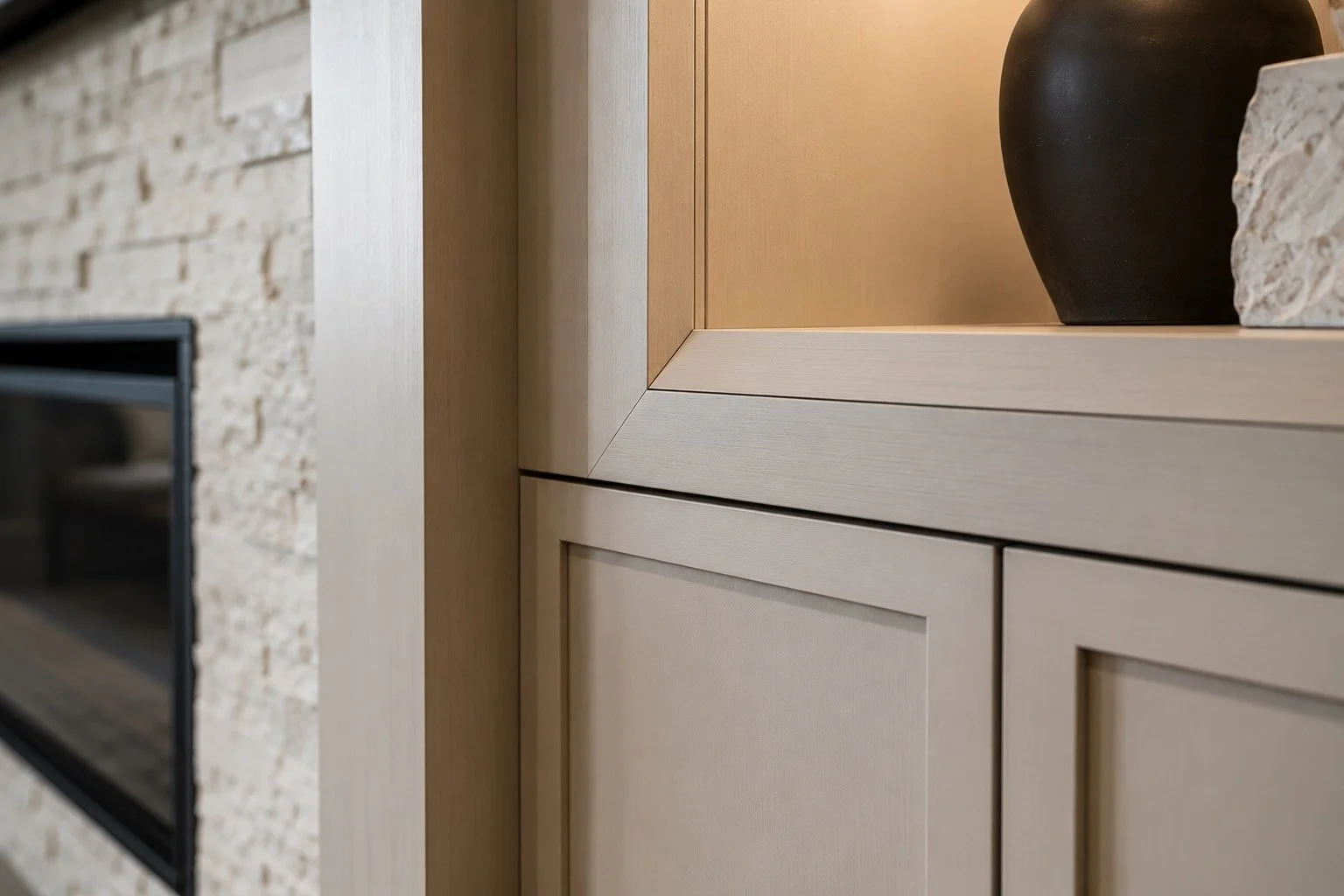 Close-up detail of custom media wall cabinetry featuring precise joinery, seamless cabinet reveals, clean shadow gaps, and professional finish carpentry craftsmanship.