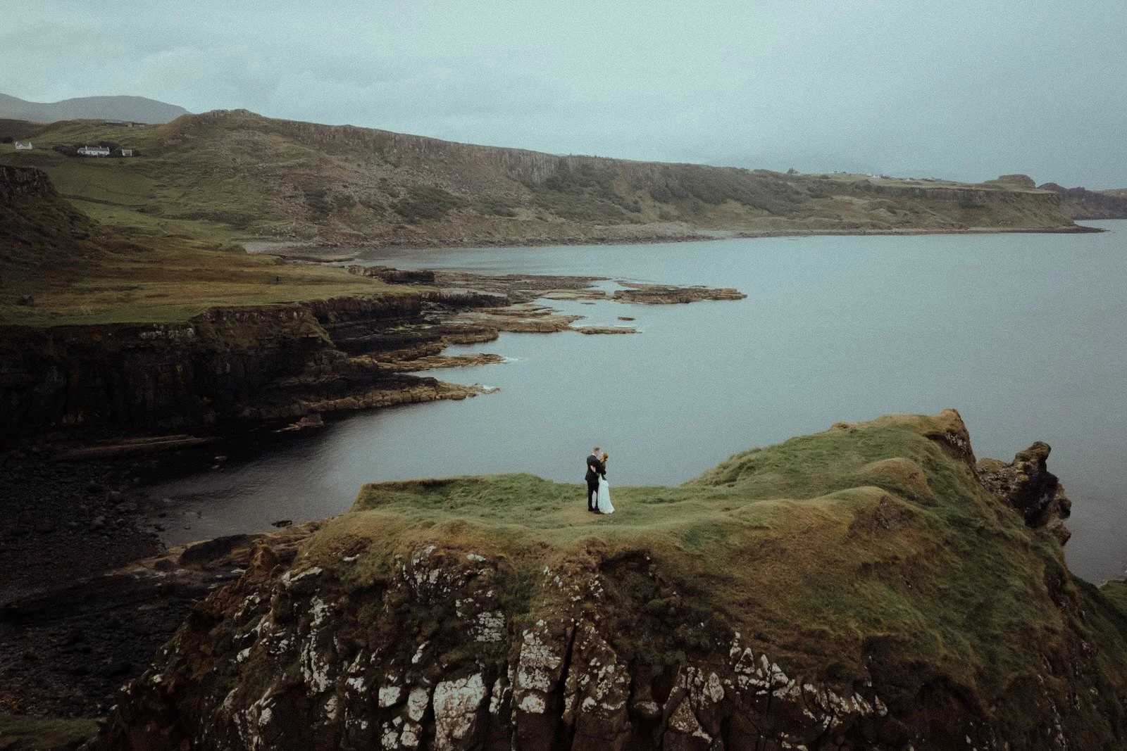 Isle Of Skye Scottish Elopement Photography at Brothers Point bride and groom embracing drone photo