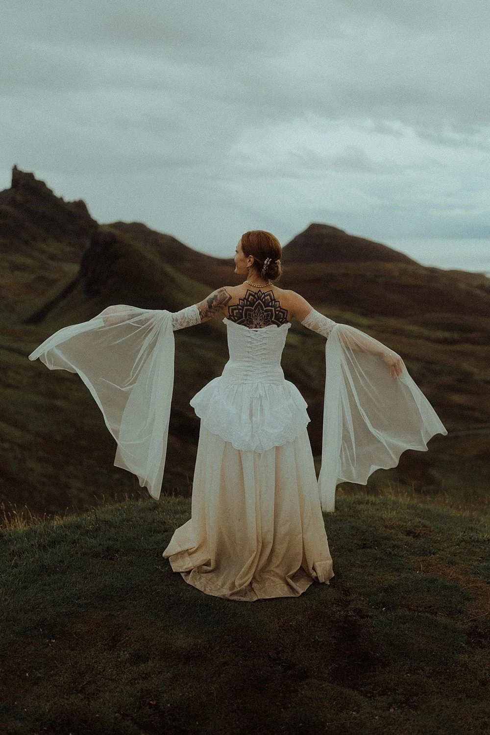 isle of skye elopement photography quiraing bride Moorea Archive dress with sleeves