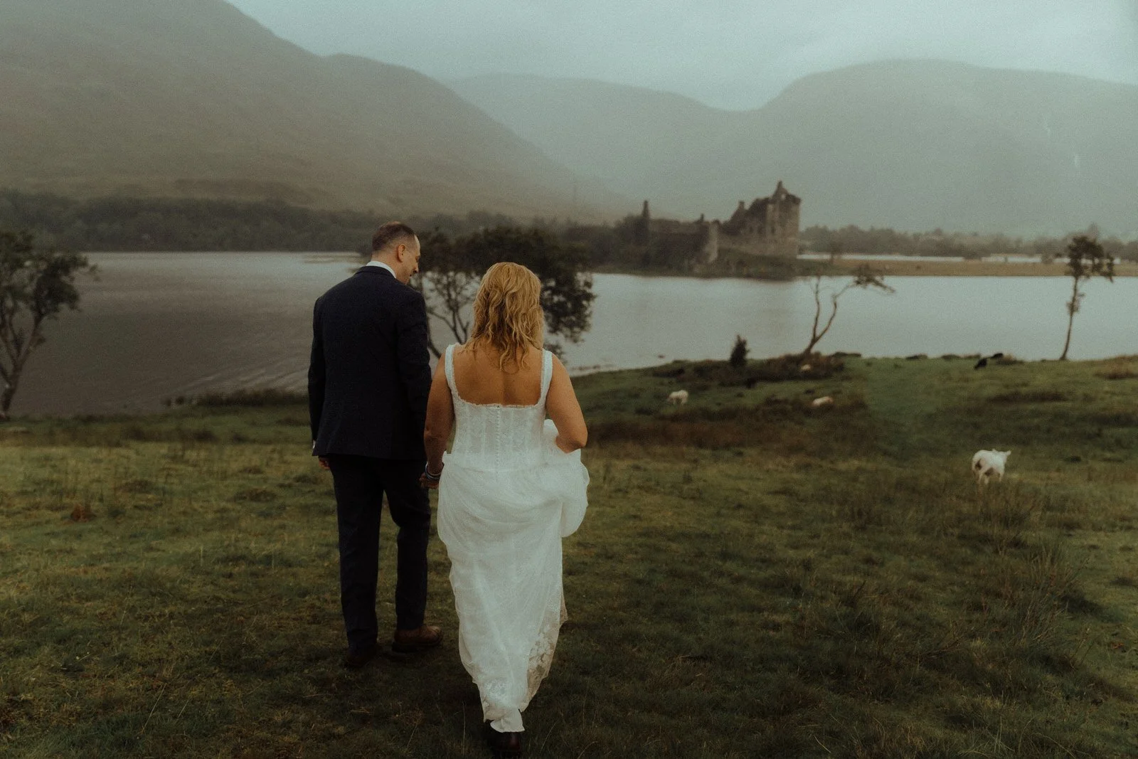 kilchurn elopement photo bride and groom sheep castle view