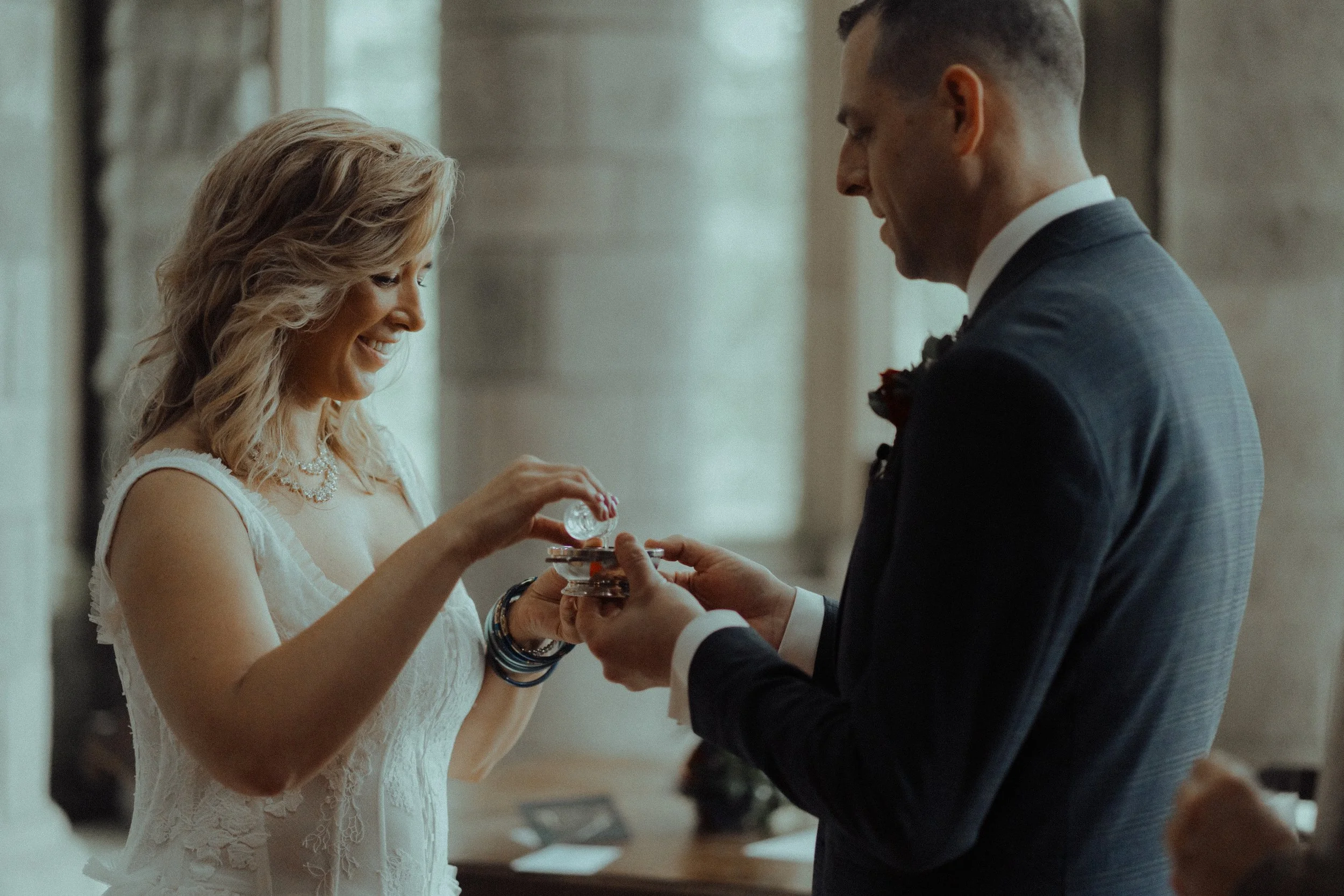 st conans kirk elopement photography bride and groom drinking from the quaich scottish tradition
