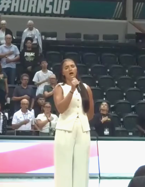 Singing the anthem.png