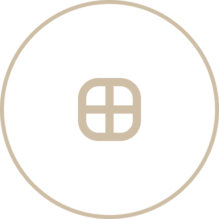 Close-up of a black button with a beige outline and letter 'B' inscribed in the center.