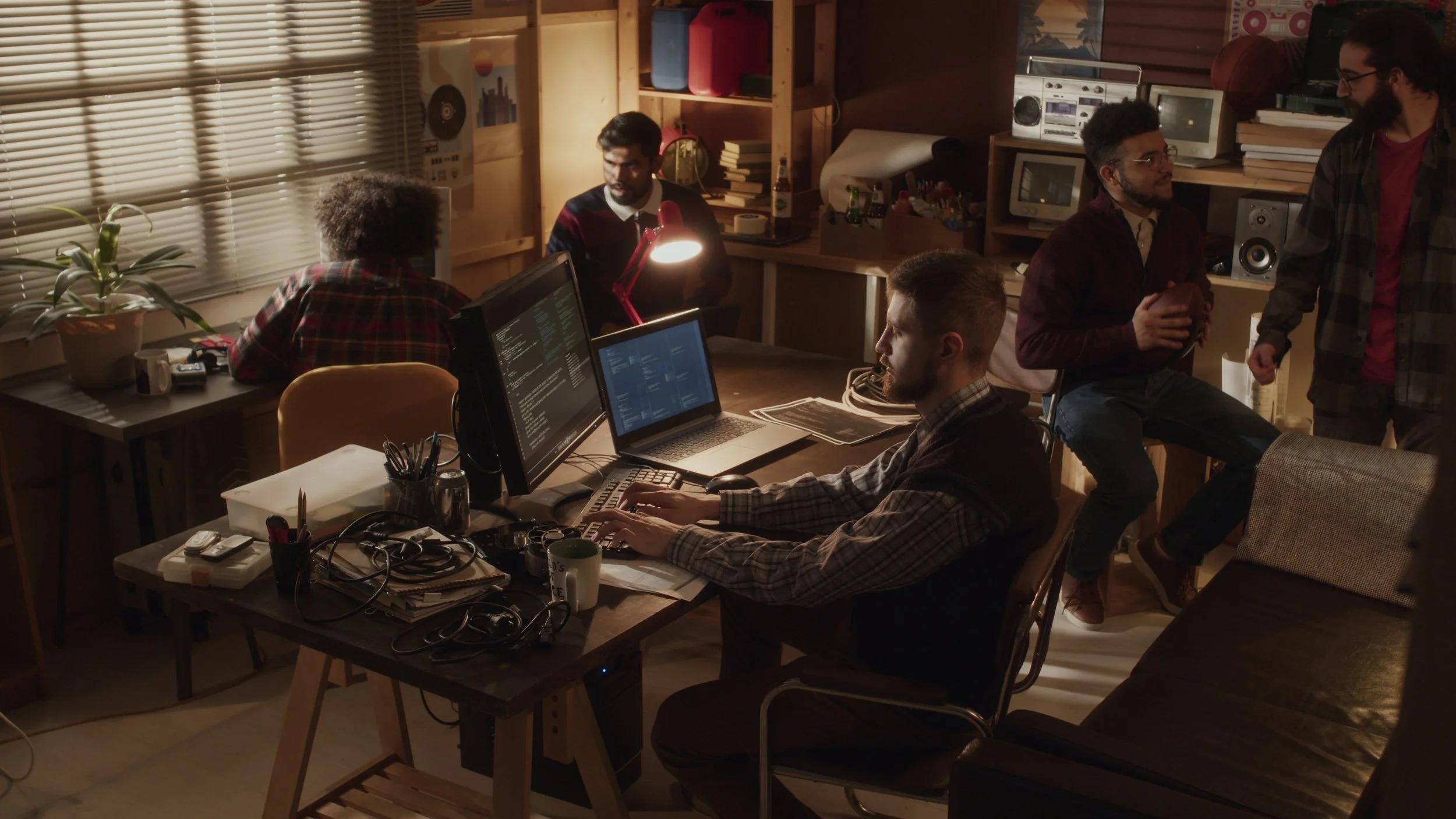 lowkey-shot-of-ethnically-diverse-group-of-tech-lovers-creating-software-startup-toget-SBI-351468509.jpg