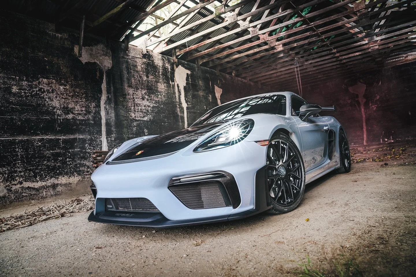 Barn find unlocked. 🔓

Our 2023 Porsche GT4RS Weissach Package &mdash; finished in Arctic Grey over a black with Deep Sea Blue accents. The perfect pair of performance and style for some fall drives! 🍁🍂

Featuring an @akrapovic Titanium Exhaust, m