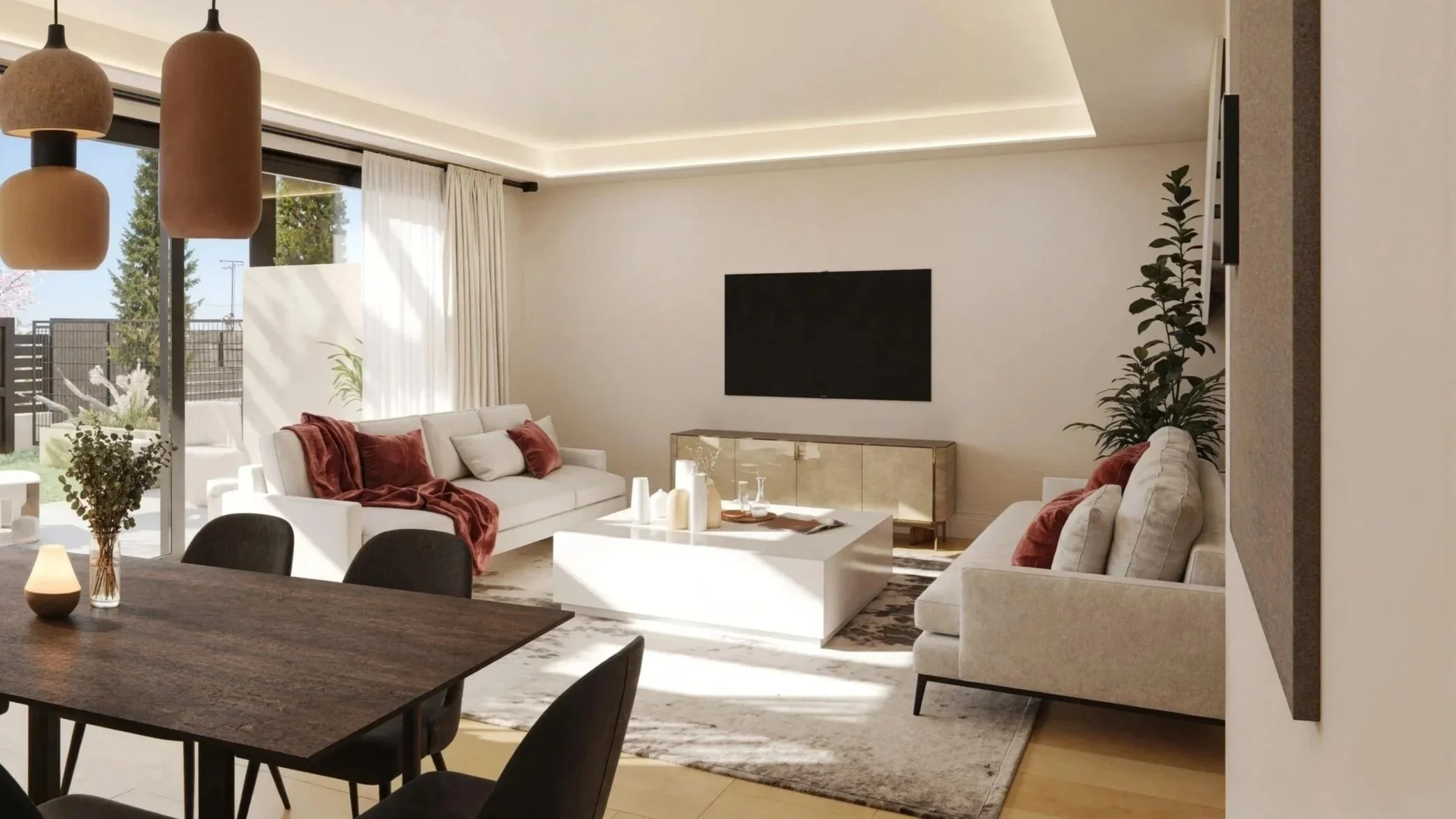 Modern living room with white sofas, a wooden dining table with black chairs, ceiling pendant lights, and a large window showing an outdoor garden with cherry blossom tree