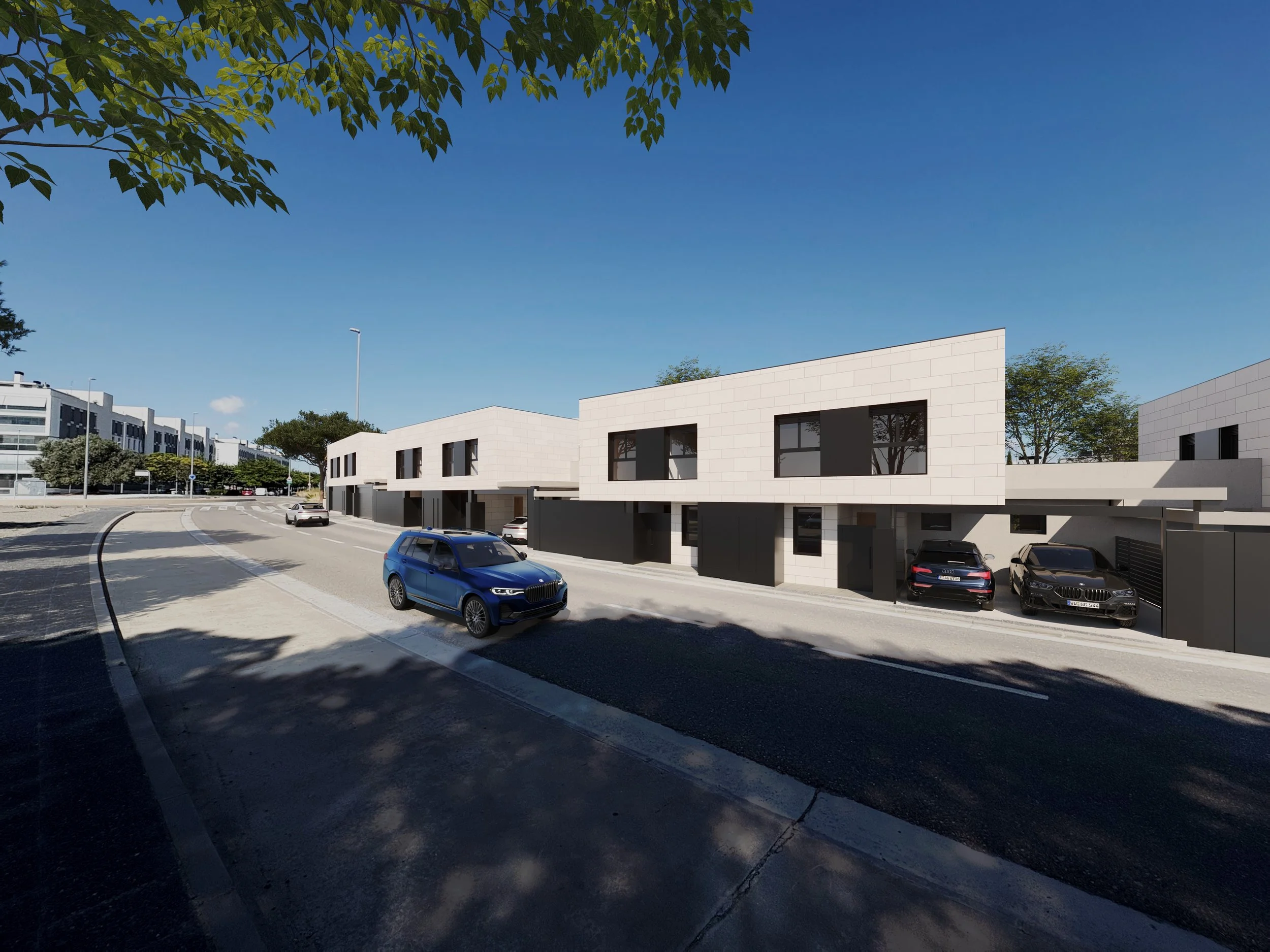 Modern residential building with black and white exterior, parked cars underneath a covered garage area, and people talking on the sidewalk. Trees and a blue sky in the background.