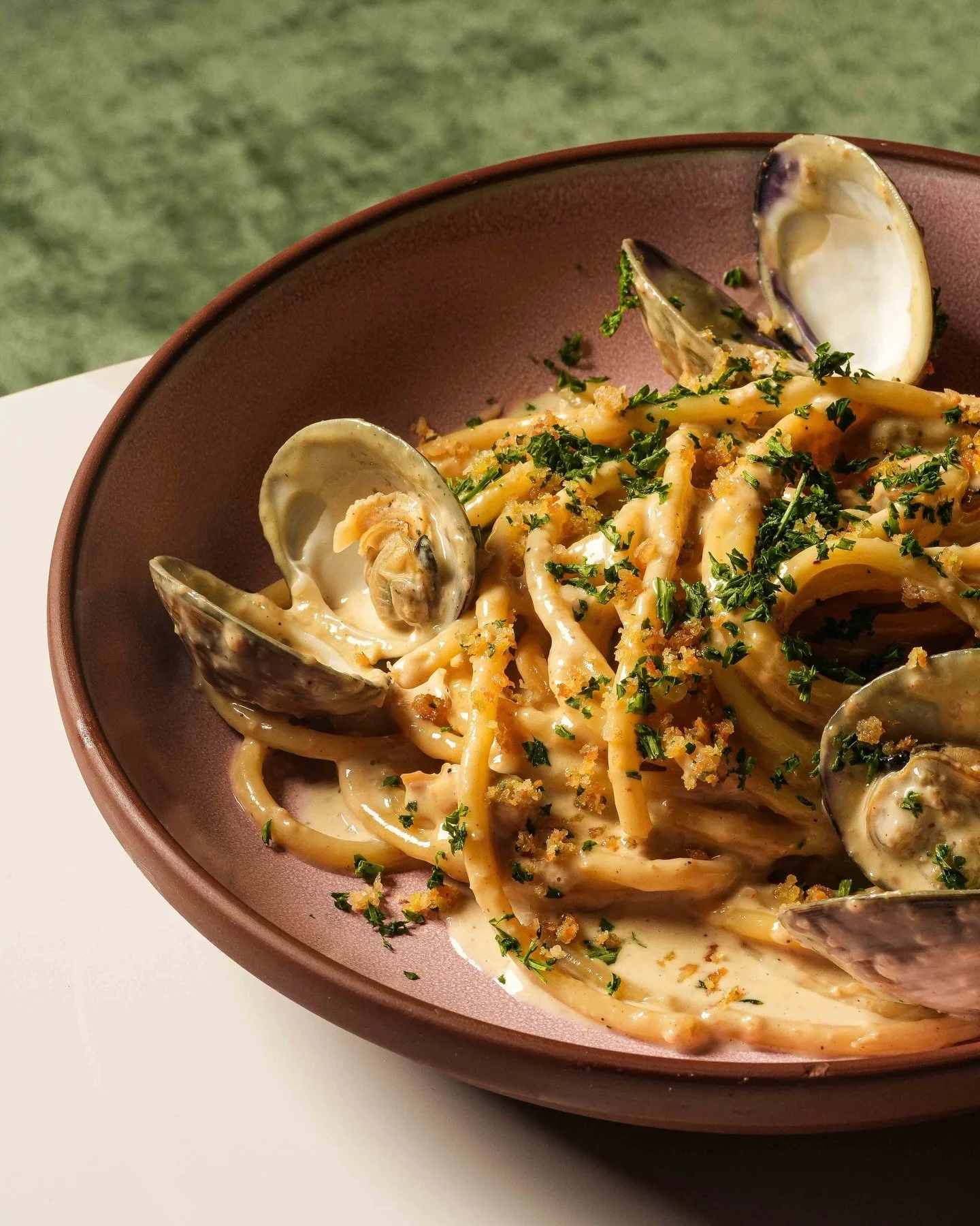 Pull up a chair. This one brings our whole crew together! 🤤 Rasta Pasta Bucatini loaded with manila clams, jerk clam bianco, and a touch of Parmigiano. @chefkwameonwuachi&rsquo;s way of spoiling us at #LasLapMiami