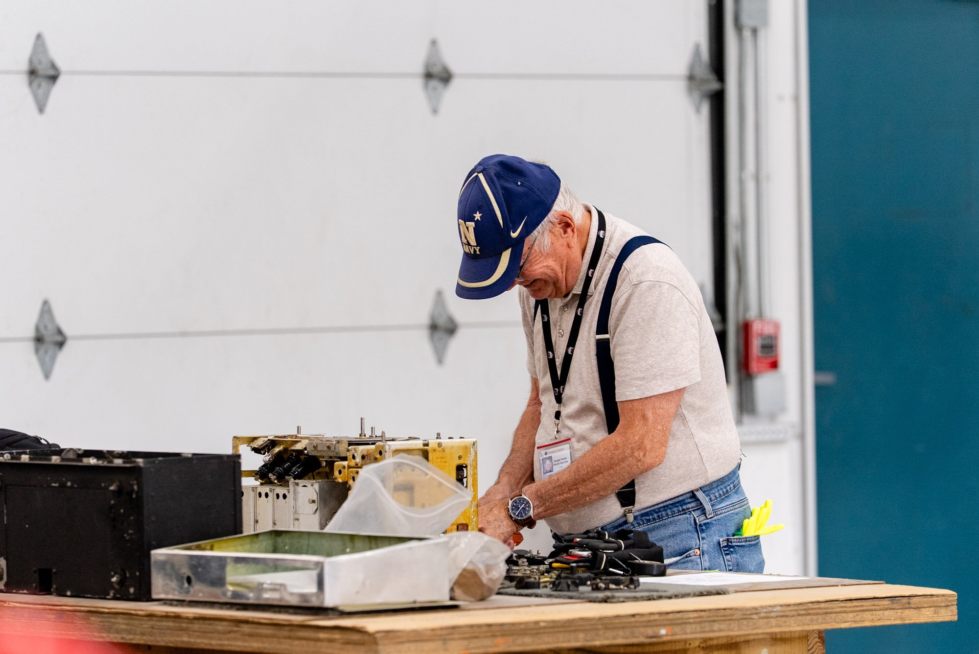 man working on radio for the restoration of Columbine II first air force one