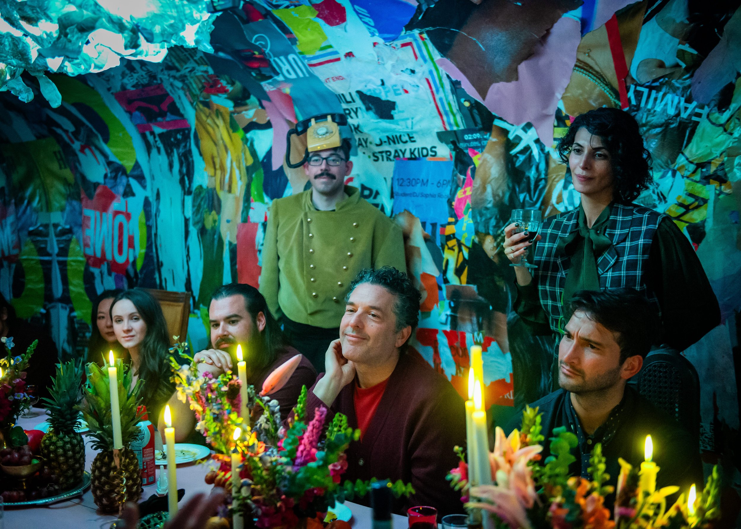 Guests sharing dinner inside the colorful participatory environment of Culinary Art of Reality