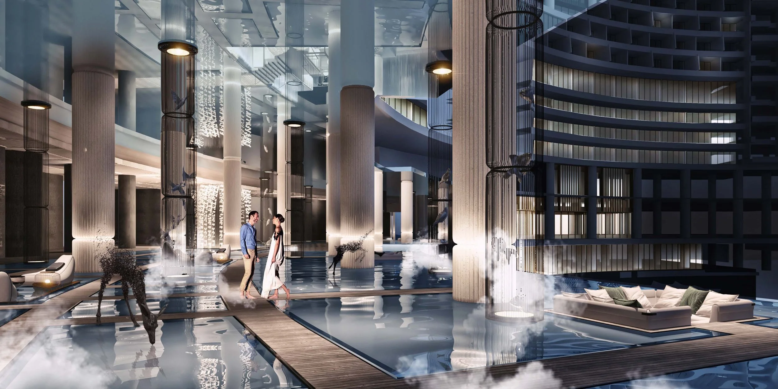 Contemporary interior with sculptural columns, water features and people moving through the space.