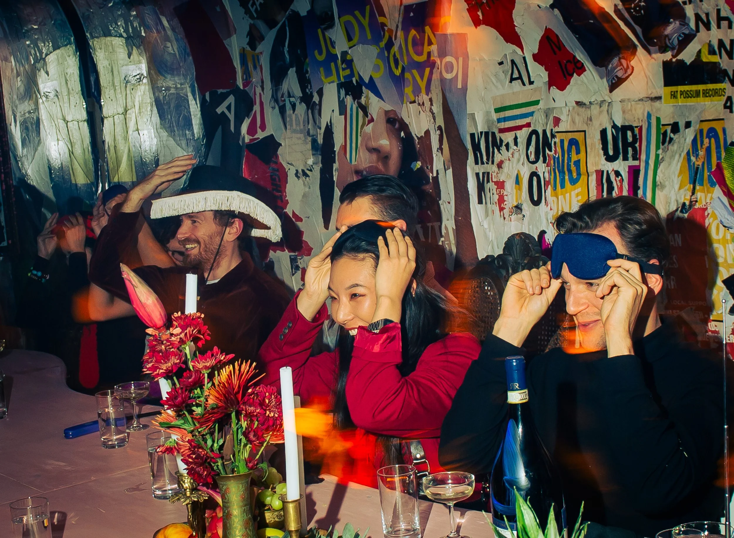 Guests wearing blindfolds during the participatory Culinary Art of Reality dining experience