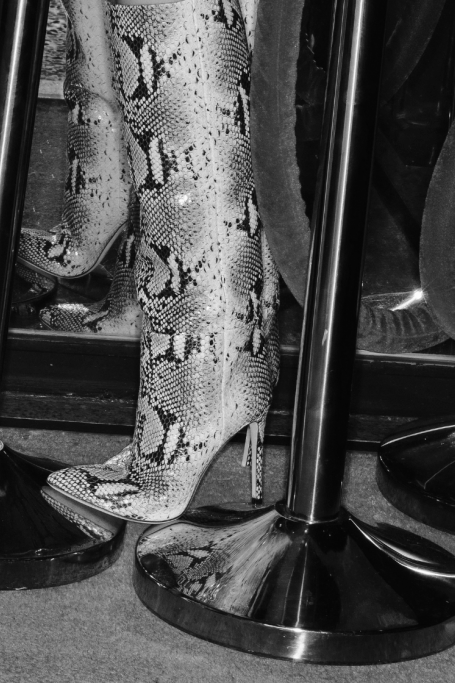 Talent wearing Paris Texas boots outdoors against the blue sky